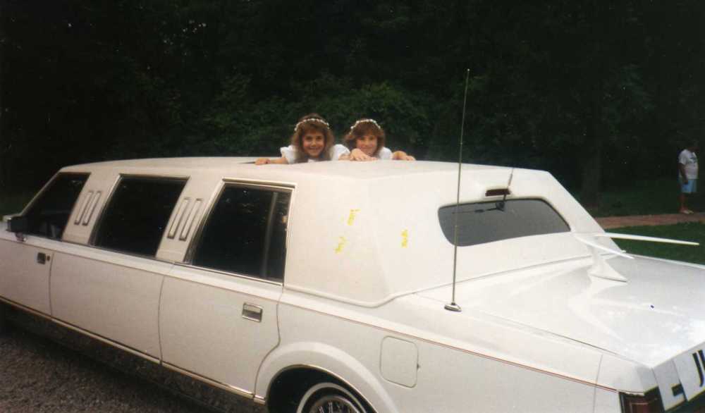 Sarah and Alysse as flower girls riding in the limo